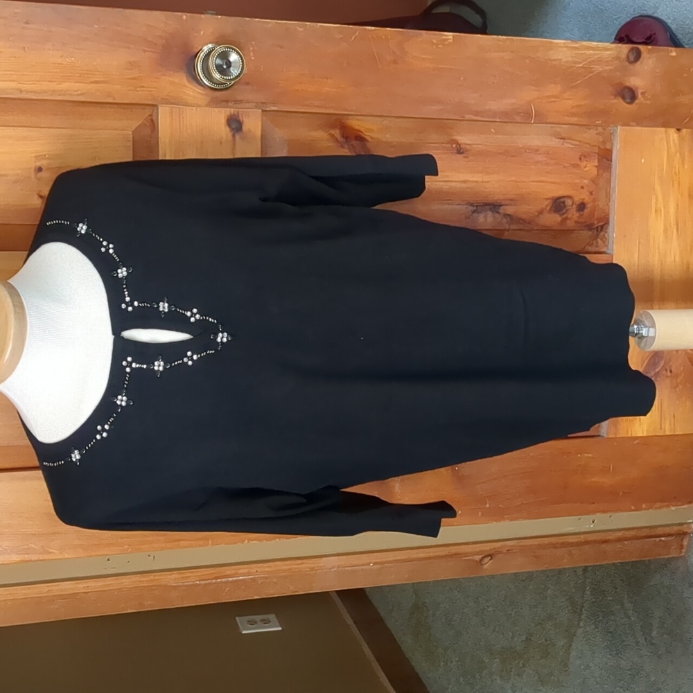 Ladies sweater with slit neck jewel accent